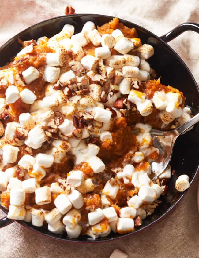 overhead view of instant pot sweet potato casserole in a black pan.