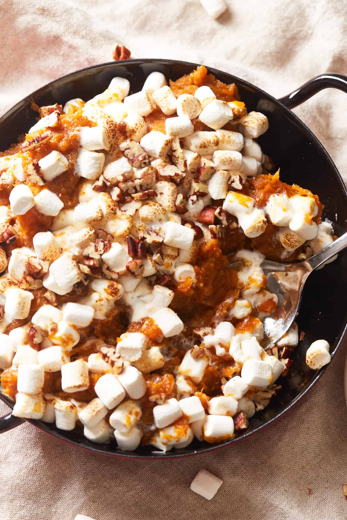 overhead view of instant pot sweet potato casserole in a black pan.