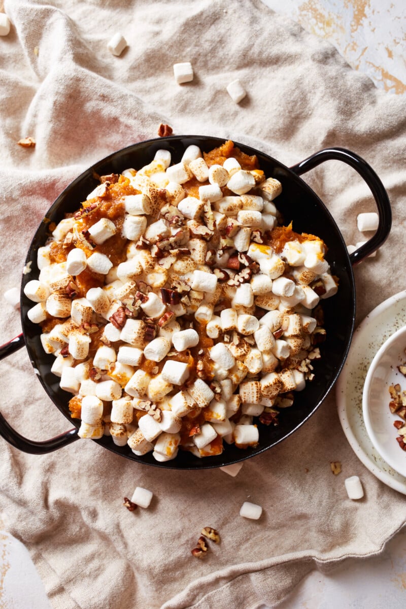 distant overhead view of instant pot sweet potato casserole in a black pan.