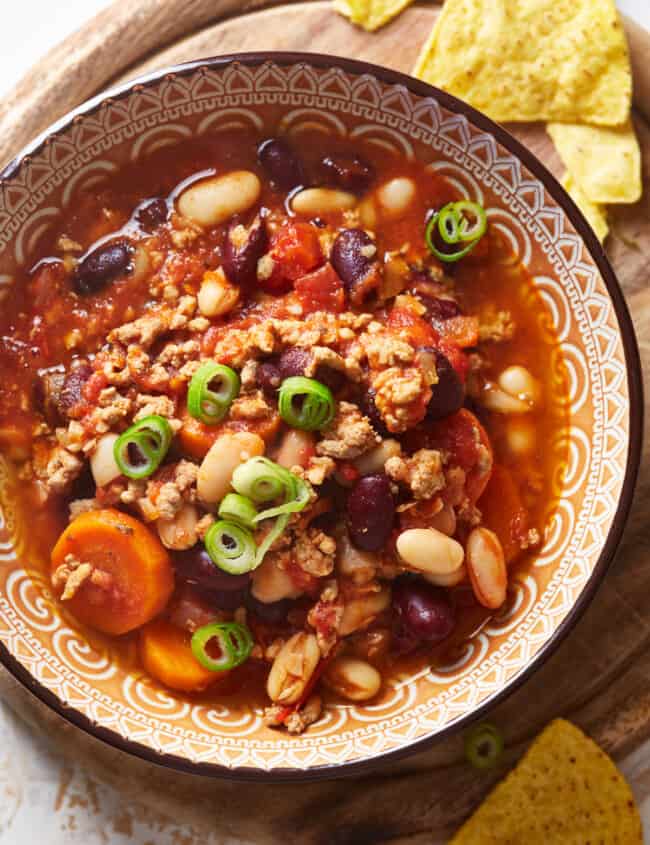 overhead view of instant pot turkey chili in a colorful patterned bowl.