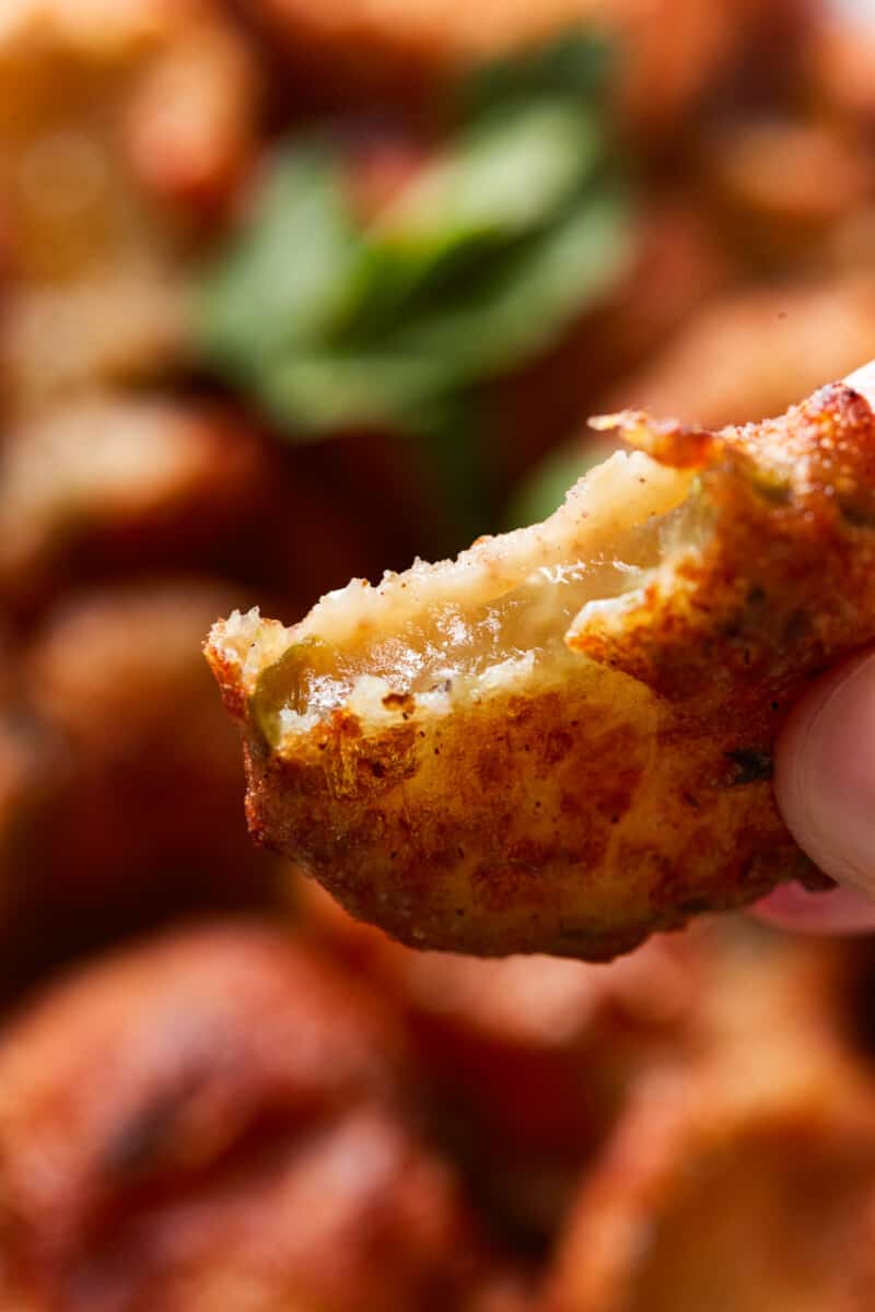 close up of a bitten ranch fried pickle.