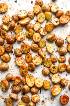 overhead view of roasted potatoes on a baking sheet.