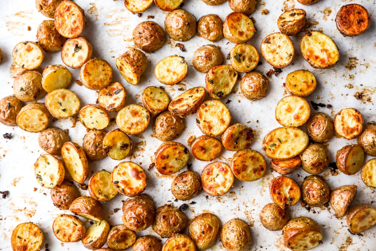 overhead view of roasted potatoes on a baking sheet.