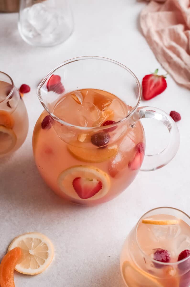 three-quarters view of a pitcher of rose sangria.