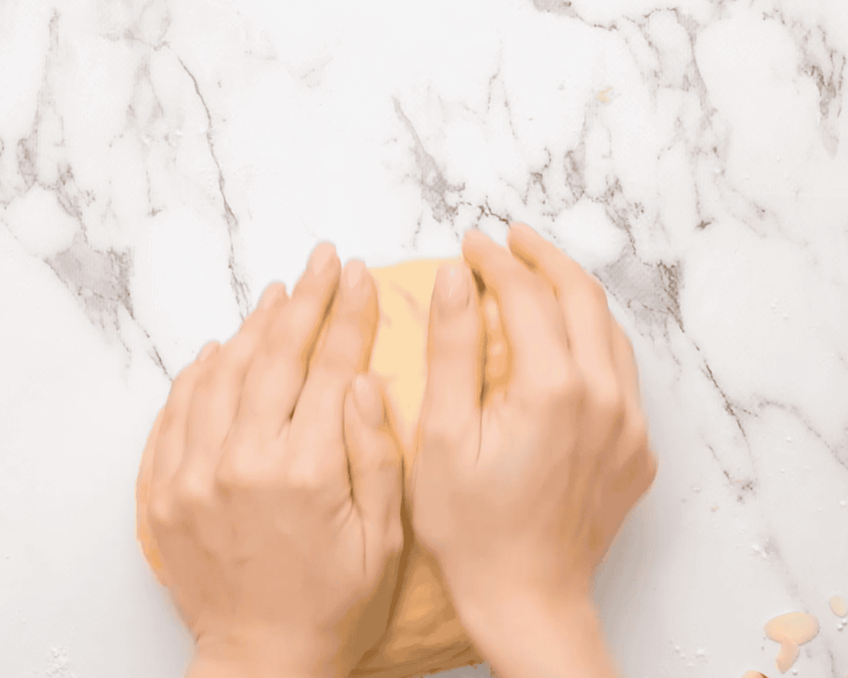 Kneading the dough with hands.