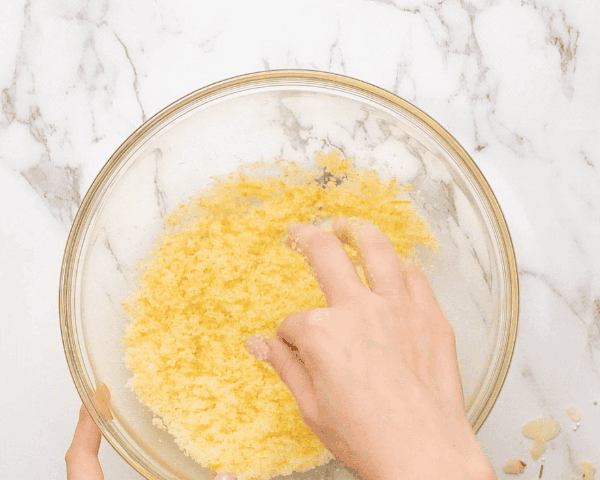 Mixing orange zest with sugar.