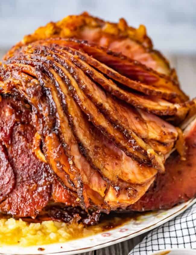 This Brown Sugar Pineapple Ham is the perfect Easter Ham recipe! We made a delicious cola and brown sugar glaze for ham, and combined it with crushed pineapples. This spiral ham is easy to make, and filled with SO much flavor!