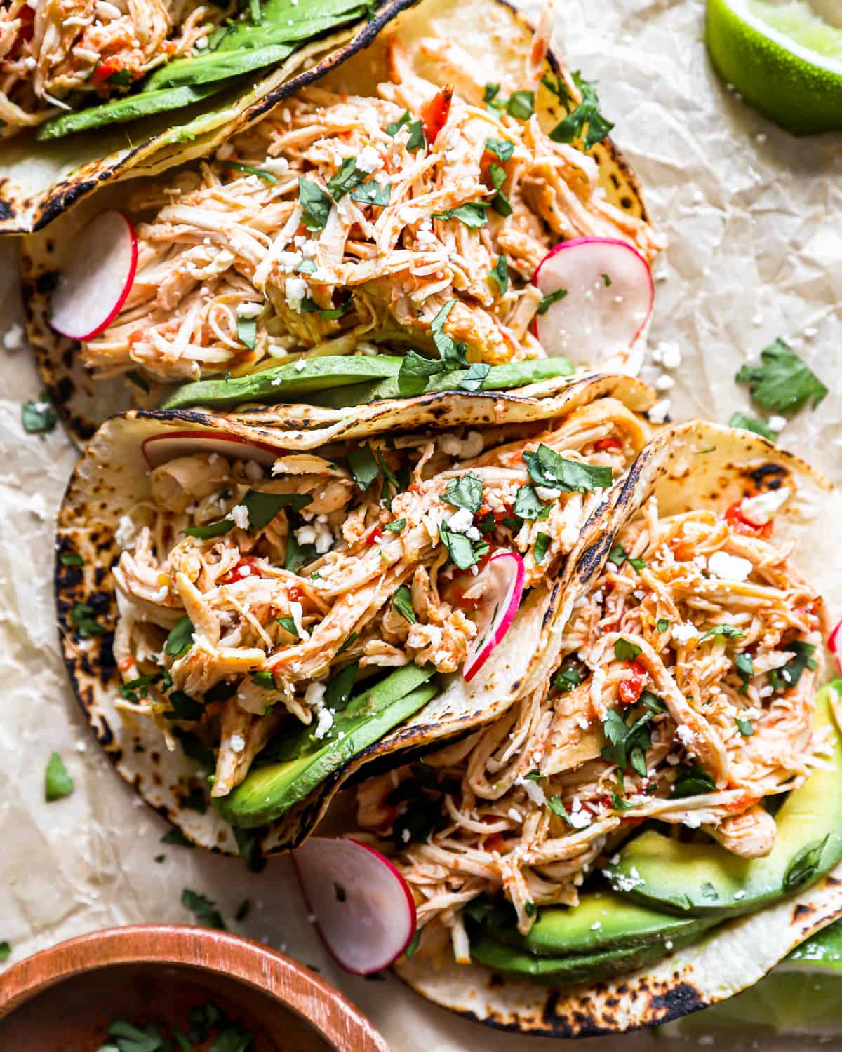 overhead view of 4 crockpot shredded chicken tacos.