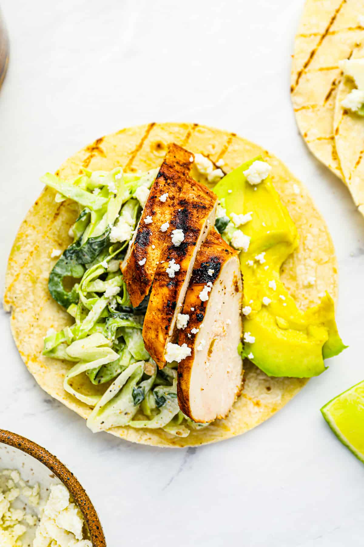 overhead view of an open-faced grilled chicken taco.