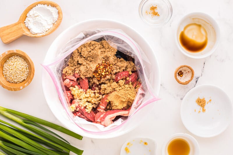 a bowl of ingredients for a recipe for beef noodle soup.
