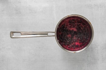 blueberry compote cooking in a saucepan.
