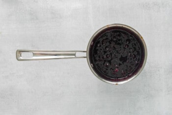 cooked blueberry compote in a saucepan.