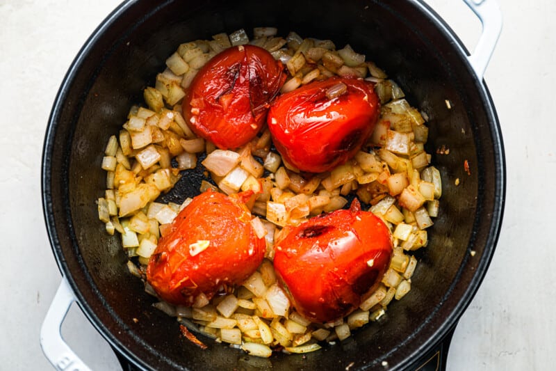 tomatoes, onion, and garlic in a dutch oven.