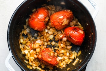 cooked tomatoes, onion, and garlic in a dutch oven with oregano and cumin.