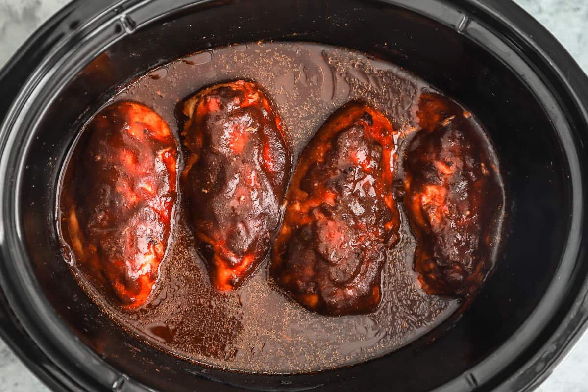 a crock pot filled with bbq chicken.