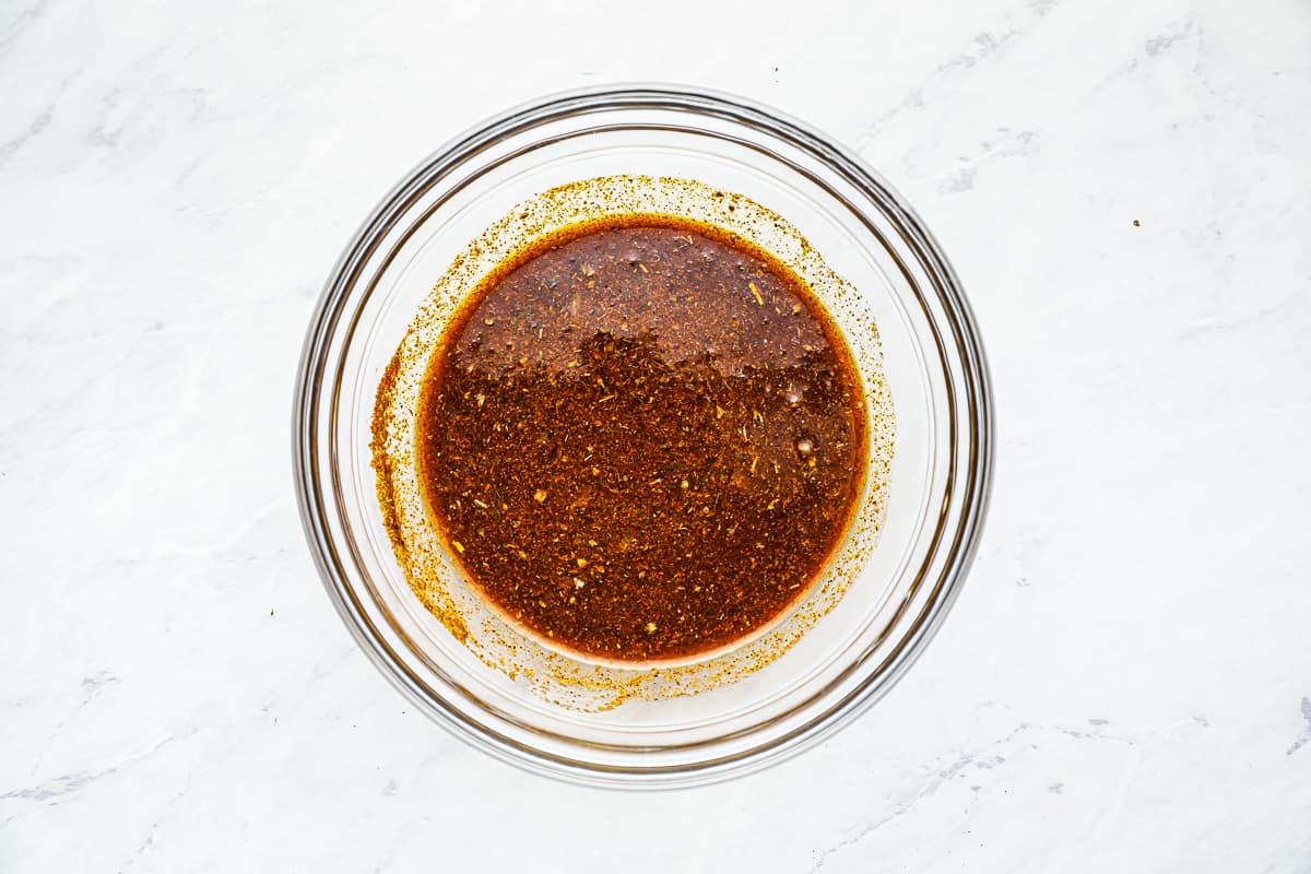 Marinade for grilled chicken tacos in a glass bowl. - 6