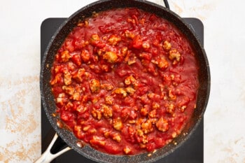 cooking marinara meat sauce in a skillet