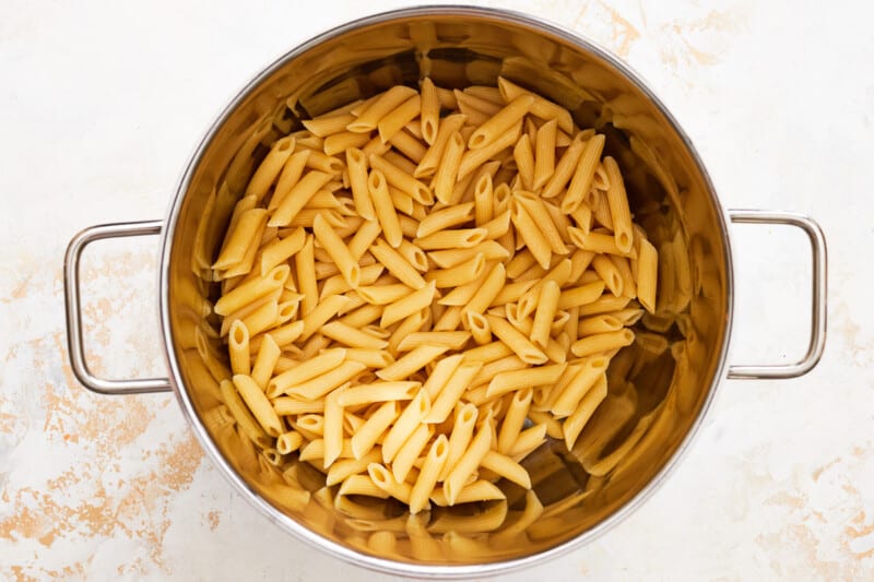 mostaccioli noodles cooking in a pot