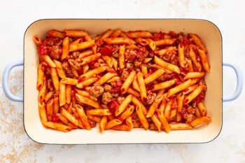 a layer of mostaccioli in a baking dish