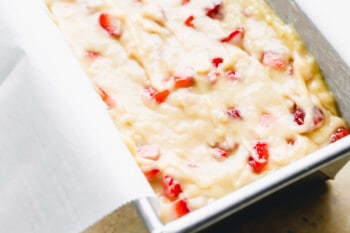 strawberry bread batter in a loaf pan.