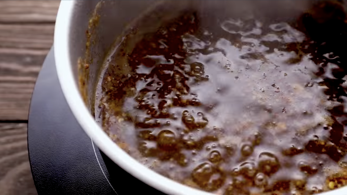 brown sugar glaze bubbling in a saucepan.