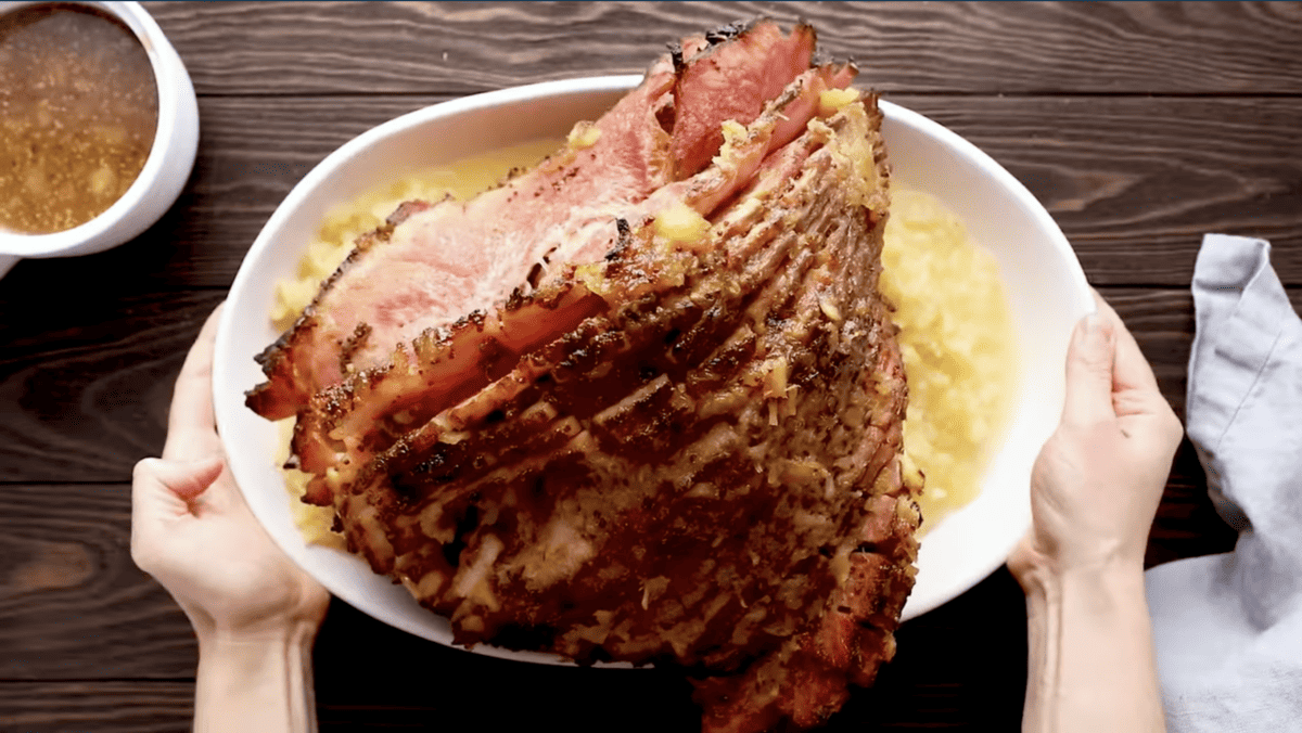 pineapple spiral ham on a white plate.