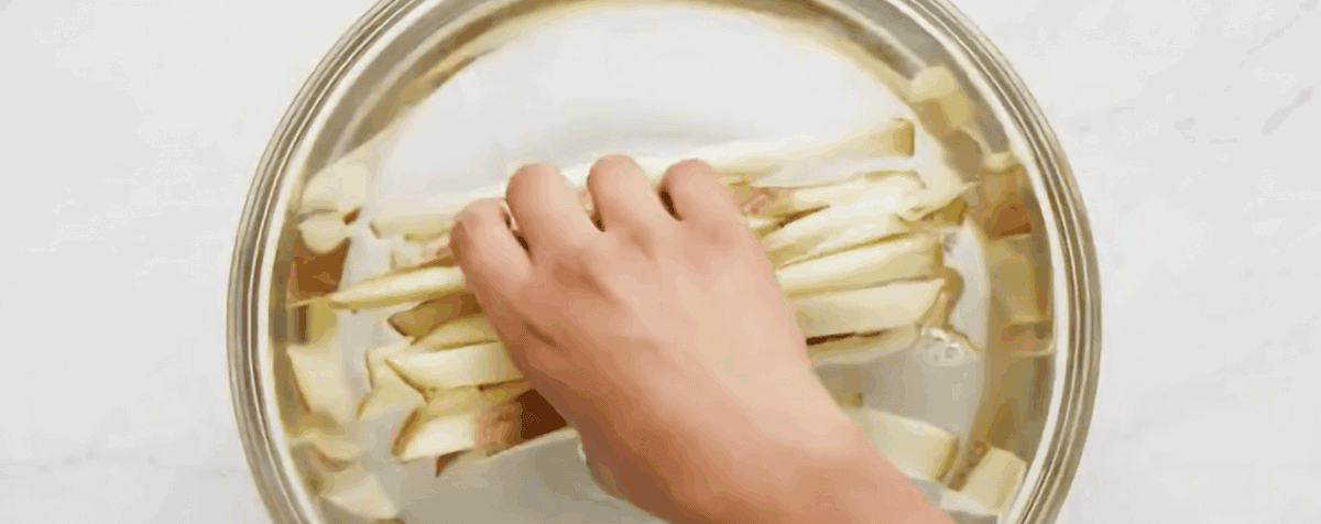 Soaking the fries in water. 
