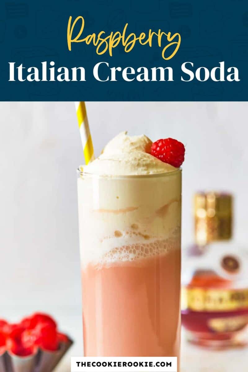 raspberry italian cream soda in a glass with a straw.