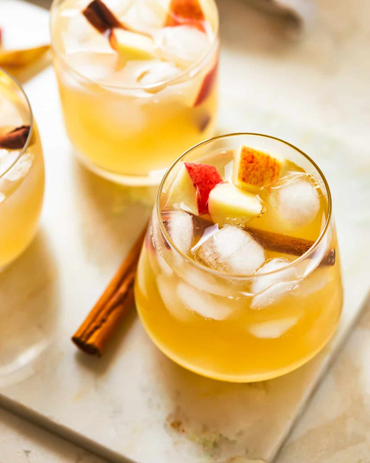 glasses of apple pie sangria served over ice