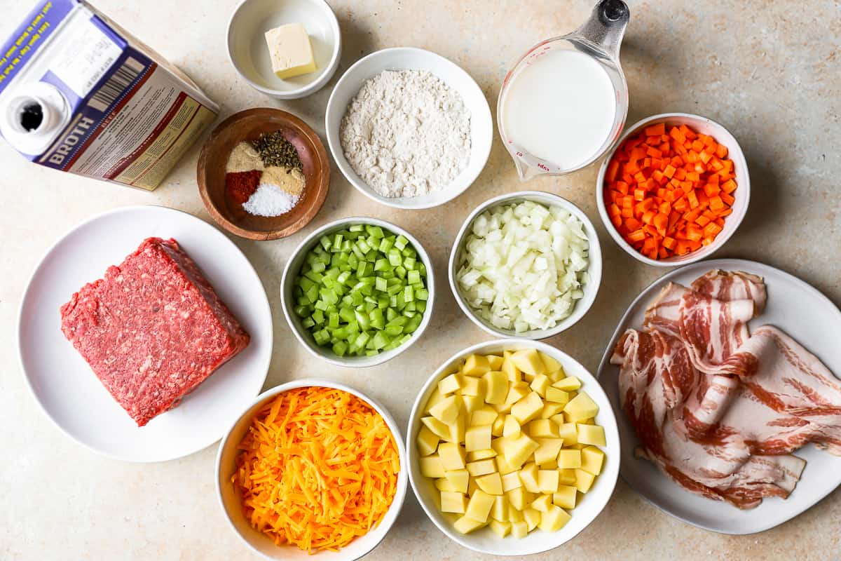 overhead view of ingredients for this cheeseburger soup recipe in individual bowls.