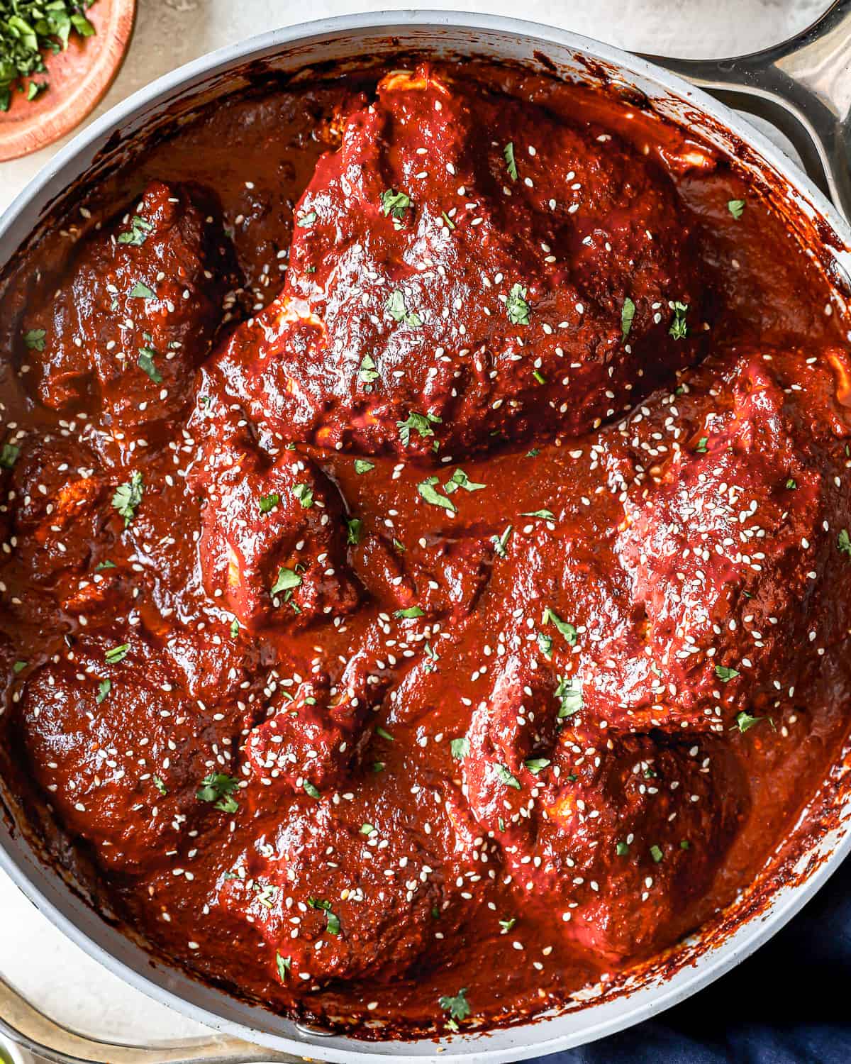 overhead view of chicken mole in a pot.