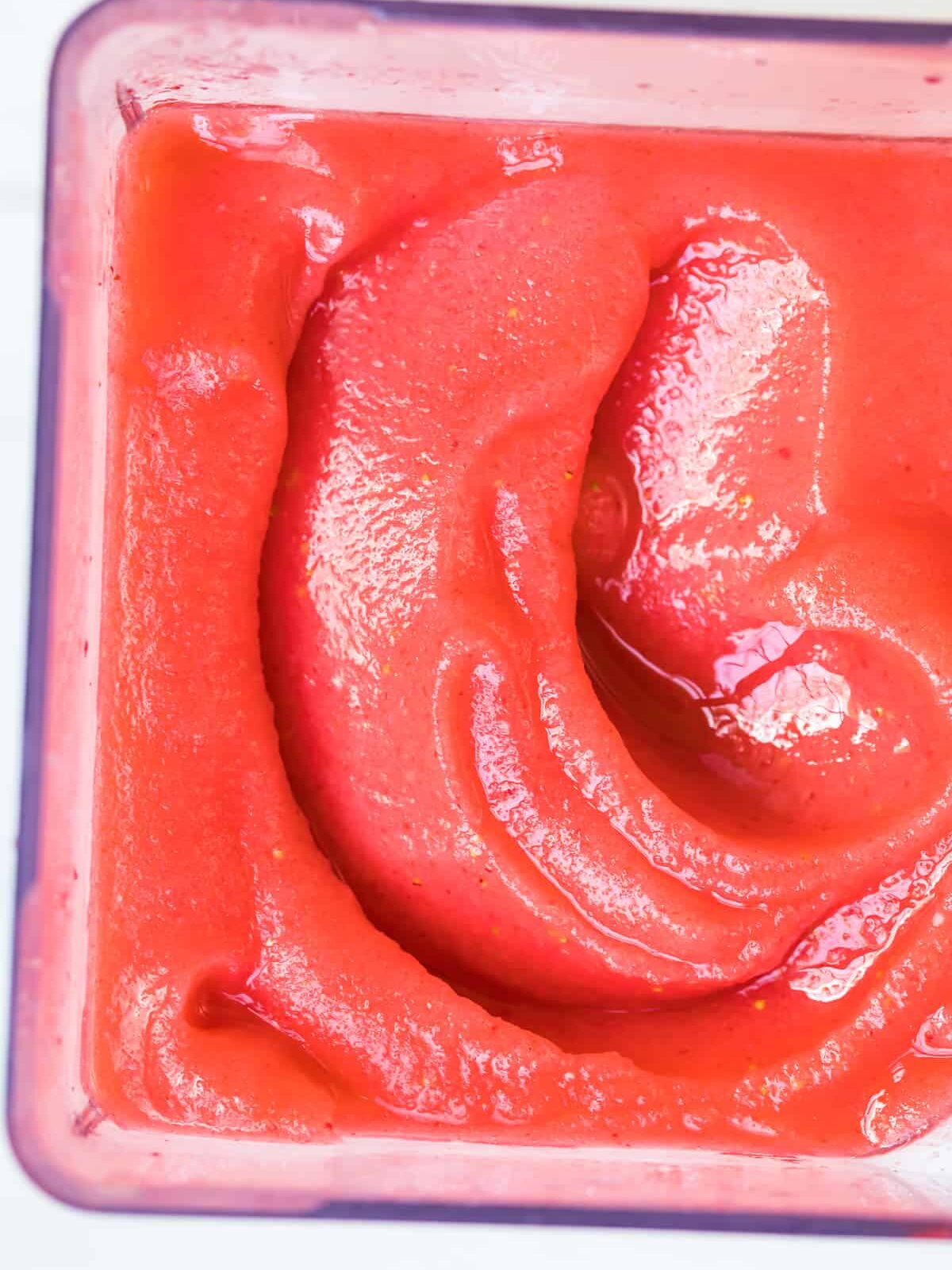 up close image of frozen strawberry margaritas in pitcher