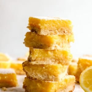 Stack of gluten-free lemon bars with shortbread crust and creamy lemon filling