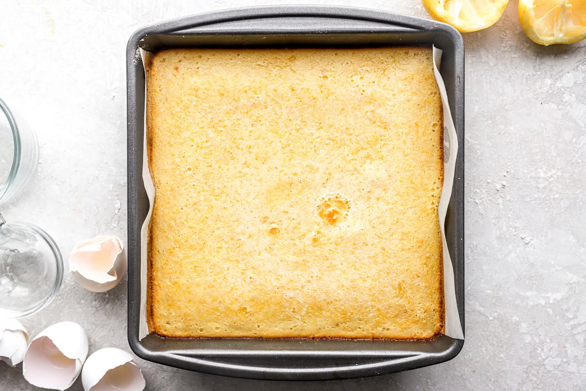 Baked gluten-free lemon bars in pan with lightly golden top