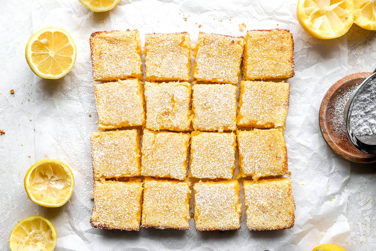 Gluten-free lemon bars cut into squares and dusted with powdered sugar