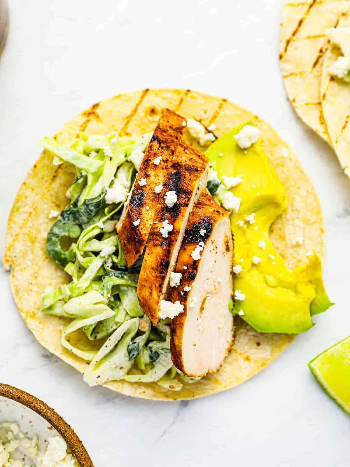 overhead view of an open-faced grilled chicken taco.