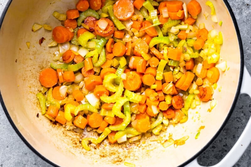 carrots, onions and celery in a pan.