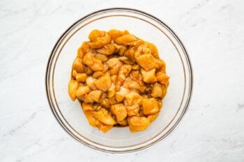 a glass bowl filled with caramelized apples.