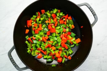stir fried peppers in a wok.
