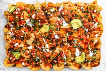 nachos supreme on a baking sheet.