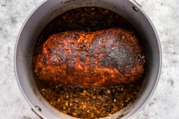 seared spice rubbed pork shoulder roast in a dutch oven.