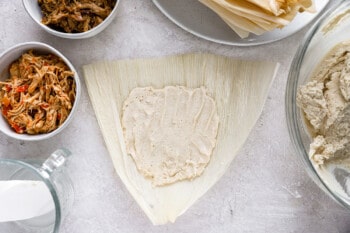 masa mixture spread over a corn husk.