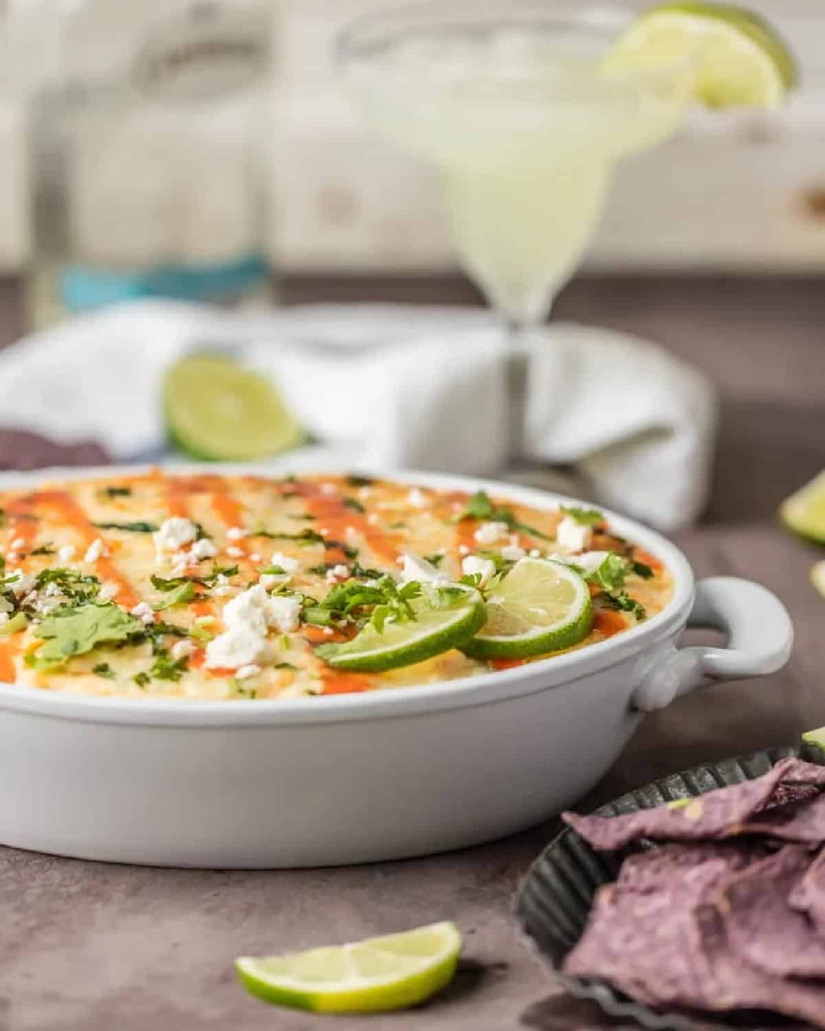 side view of mexican street corn dip in a white dish