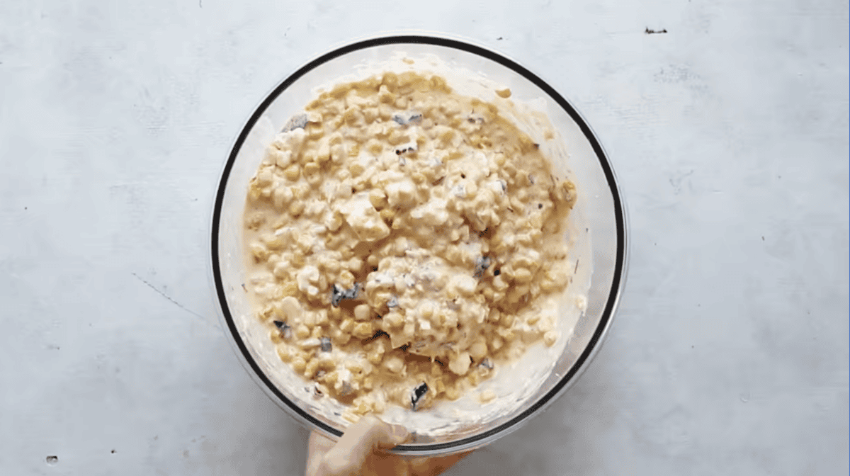 mexican street corn dip in a glass bowl.