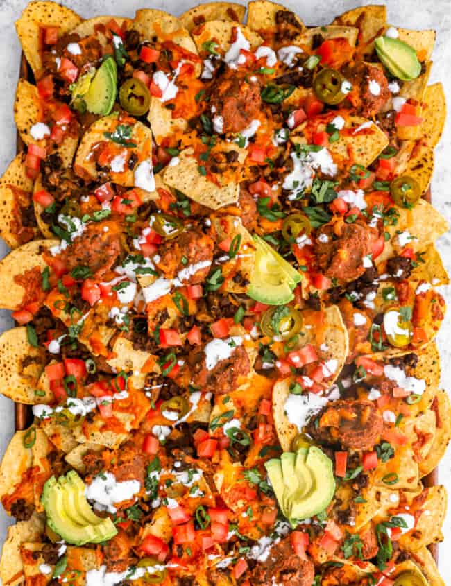 overhead view of nachos supreme on a baking sheet,
