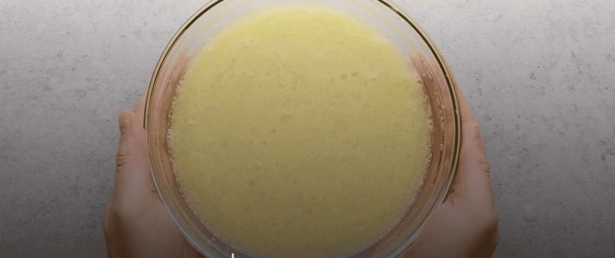 Combining wet ingredients into a bowl.