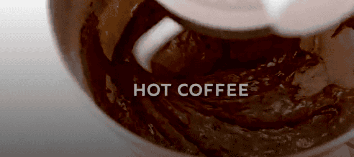 Adding hot coffee to the cake mixture. 
