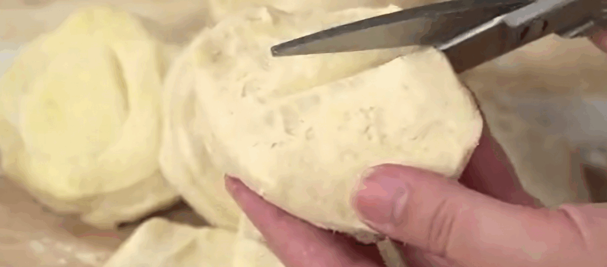 Cutting the biscuit dough.
