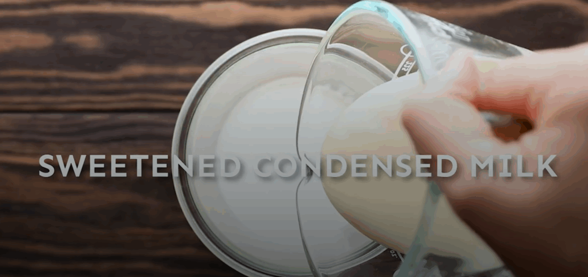 Combining cream and sweetened condensed milk. 
