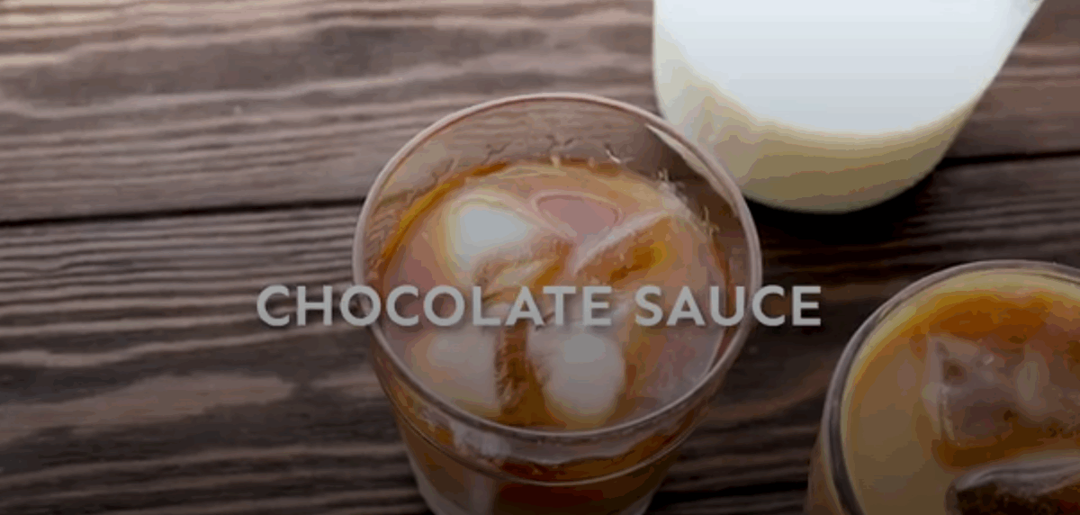 Adding optional add ins to a cold brewed cup of coffee. 